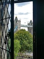 London, England, 2020 - View of London Tower Bridge through a  window