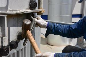 Worker using a mallet photo