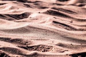 Close-up of sand during the day photo