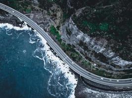 Aerial view of a road near the ocean photo