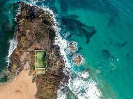 Aerial view of a rocky shore near the ocean photo