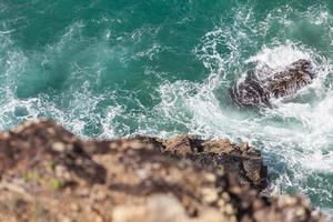 Aerial view of a cliff near the ocean photo