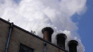 Smoke and steam from industrial plant video