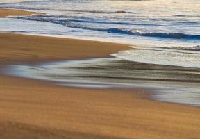 Time-lapse of waves on beach photo