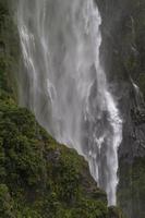 Waterfall near trees at daytime photo