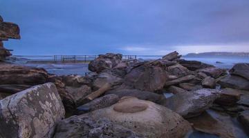 Rocky coast at night photo