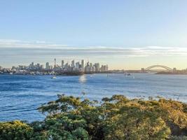 Cityscape across the bay at sunset photo