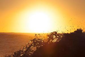 Ocean waves at golden hour photo