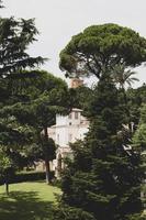 Rome, Italy, 2020 - Concrete building surrounded by trees photo