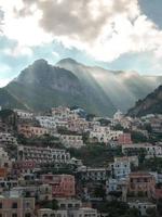 White and brown buildings near mountain photo