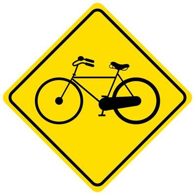 Bicycle traffic warning yellow sign on white background