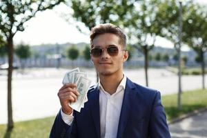 The young businessman shows off his profit photo