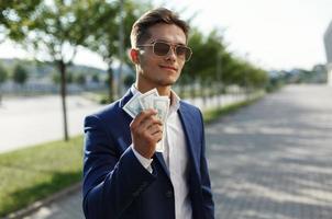 Man holding a lot of money photo