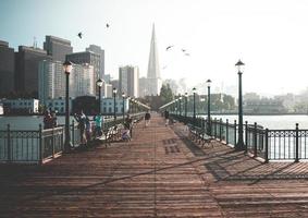 San Fransisco, CA 2018-Tourists line the Pier 7 boardwalk photo