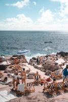 Naples, Italy, 2019-Tourists sunbathe off the coast of Capri photo