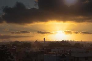 Silhouette of a city at sunset photo