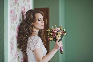 The girl with a bouquet indoors