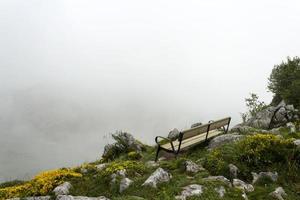Mountain bench on cloudy day photo