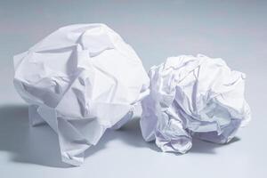 Crumpled paper on white background photo