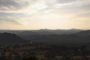 Silhouette of mountains at sunset photo