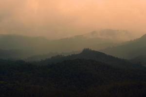 Silhouette of mountains at sunset photo