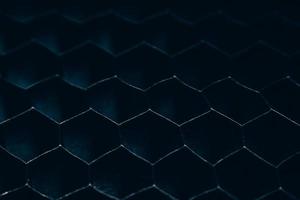 Close-up of a fence in the dark photo