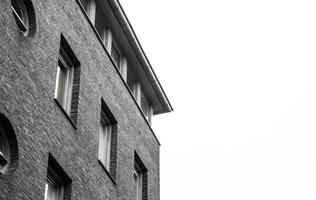 Grayscale of a brick building photo