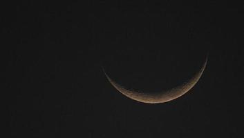 A view of a crescent moon photo