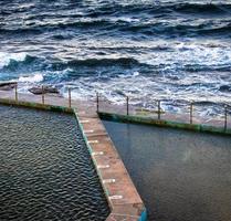 Aerial view of dock and waves photo