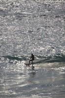New South Wales, Australia, 2020 - Woman surfing during daytime photo