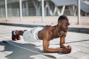 Fit man doing plank photo