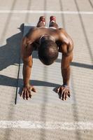 African American man doing push-ups photo