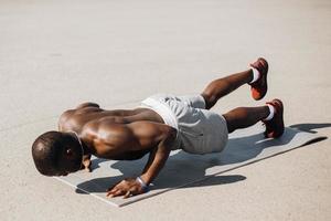 African American man does push-ups photo