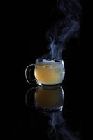 Glass mug with hot liquid photo