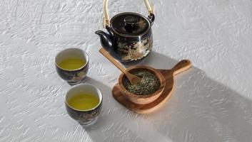 Tea served with wooden bowl and spoon photo