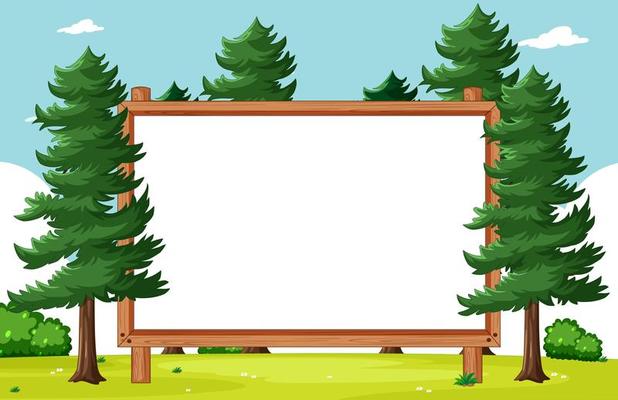 Blank wooden frame with pines in park scene