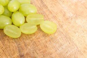 Grapes on wooden background photo