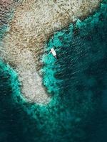 Aerial view of a boat near shore photo