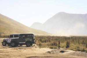 East Java, Indonesia, 2020 - Two SUVs near mountains during the day photo