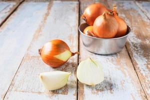 Onion on a wooden table photo