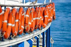 Close-up of a boat with lifebuoys on it photo