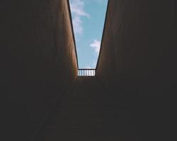 Dark staircase leading outside photo