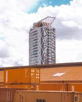 Kampala, Uganda, 2020 - Freight containers in front of a high-rise building photo