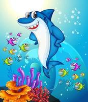 Personaje de dibujos animados de tiburón feliz en la escena submarina con muchos peces exóticos vector