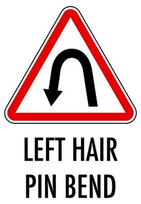 Left hair pin bend sign isolated on white background