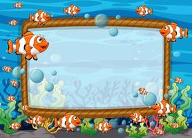 Blank frame template with exotic fishes cartoon character in the underwater scene vector