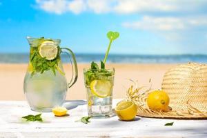 Lemon drink  and beach in the background photo