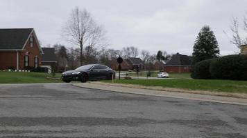 Car Driving Around A Neighborhood Roundabout video