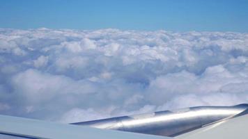 Airplane flying thru beautiful clouds 4K stock video