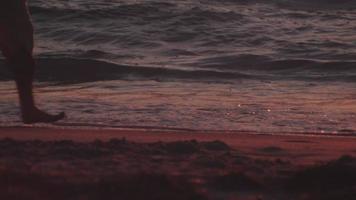 Low angle of couples feet on shore video